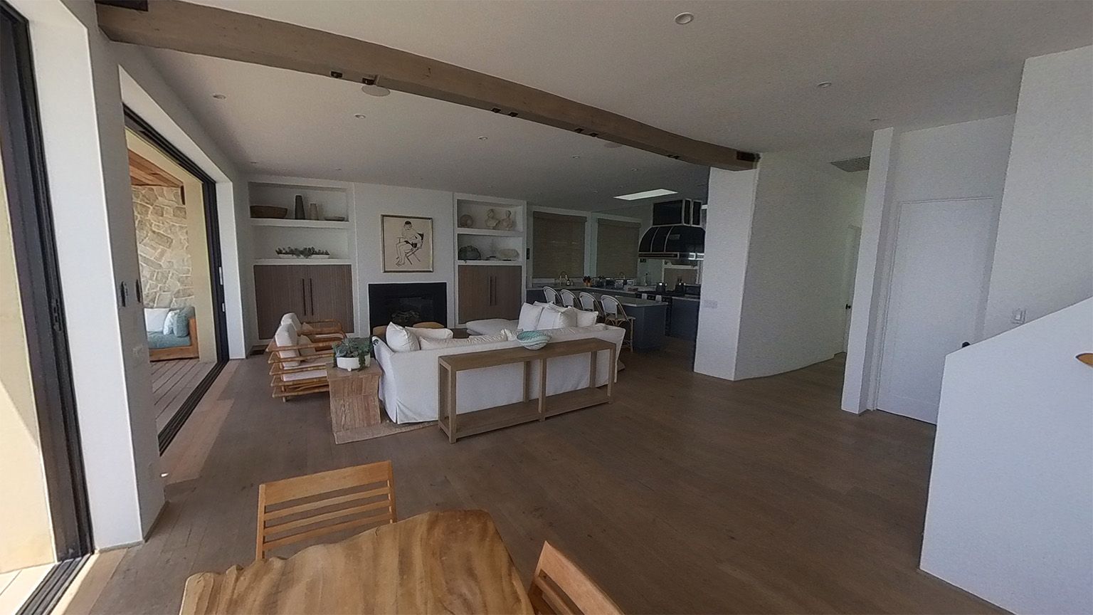 Custom travertine dining room with soaring ceilings and expansive glass walls